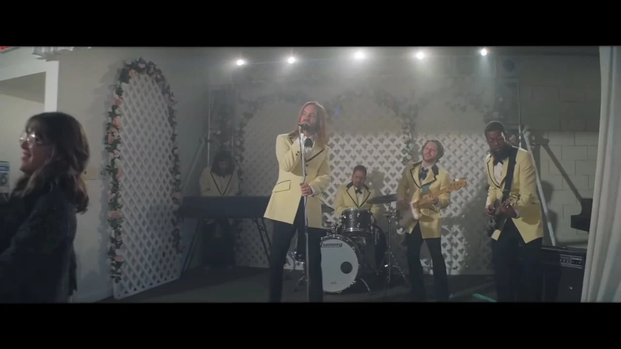 A band performs in a bright reception hall in a frame from Nick Schwyter's Steadicam reel.